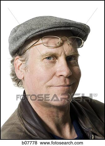 Stock Photo - Portrait of a mature man in a flatcap. Fotosearch