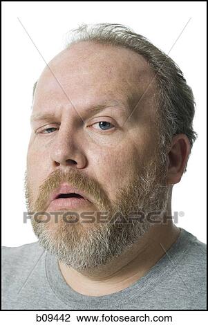 Portrait of a mature man making a face View Large Photo Image Stock Image - Portrait of a mature man making a face. Fotosearch