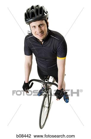 Portrait of a mature man on a bicycle View Large Photo Image Stock Image - Portrait of a mature man on a bicycle. Fotosearch