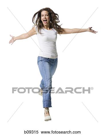 Portrait of a mid adult woman running with her arms outstretched View Large Photo Image Stock Photography - Portrait of a mid adult woman running with her arms outstretched. Fotosearch