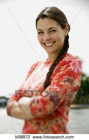 Portrait of a mid adult woman smiling View Large Photo Image Stock Image - Portrait of a mid adult woman smiling. Fotosearch