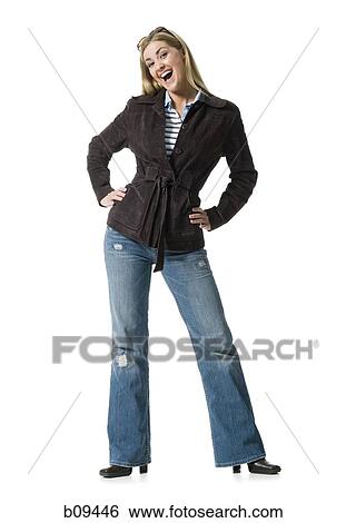 Stock Photograph - Portrait of a mid adult woman with her hands on her hips. Fotosearch
