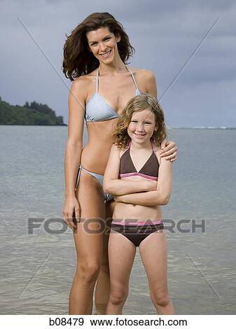 Portrait of a mother and her daughter smiling View Large Photo Image Stock Photo - Portrait of a mother and her daughter smiling. Fotosearch