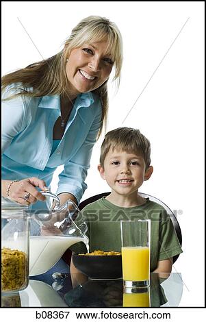Portrait of a mother and her son at the breakfast table View Large Photo Image Stock Photo - Portrait of a mother and her son at the breakfast table. Fotosearch