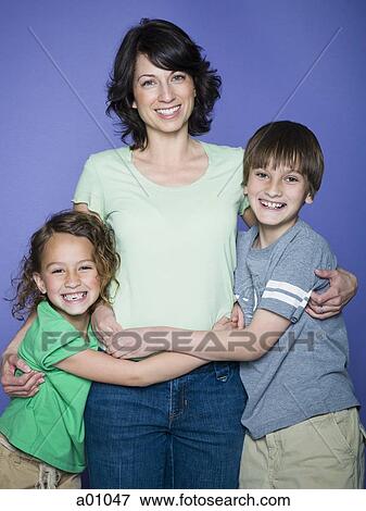 Stock Photo - Portrait of a mother and her two children. Fotosearch