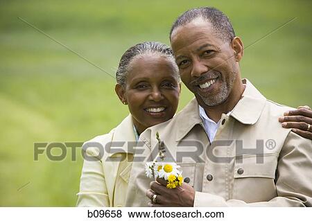 Portrait of a senior man and a senior woman smiling View Large Photo Image Stock Photo - Portrait of a senior man and a senior woman smiling. Fotosearch