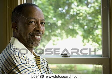 Portrait of a senior man smiling View Large Photo Image Stock Photograph - Portrait of a senior man smiling. Fotosearch