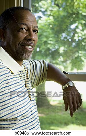 Portrait of a senior man smiling View Large Photo Image Stock Photography - Portrait of a senior man smiling. Fotosearch