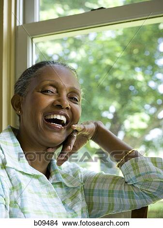 Portrait of a senior woman smiling View Large Photo Image Picture - Portrait of a senior woman smiling. Fotosearch