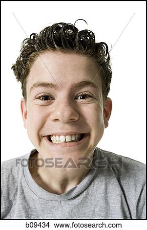 Portrait of a teenage boy grinning View Large Photo Image Picture - Portrait of a teenage boy grinning. Fotosearch