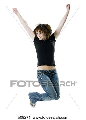 Portrait of a teenage girl jumping in mid-air with her arms raised View Large Photo Image Stock Image - Portrait of a teenage girl jumping in mid-air with her arms raised. Fotosearch