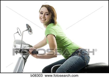 Portrait of a teenage girl riding a scooter View Large Photo Image Stock Image - Portrait of a teenage girl riding a scooter. Fotosearch