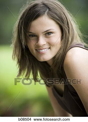 Portrait of a teenage girl smiling View Large Photo Image Picture - Portrait of a teenage girl smiling. Fotosearch