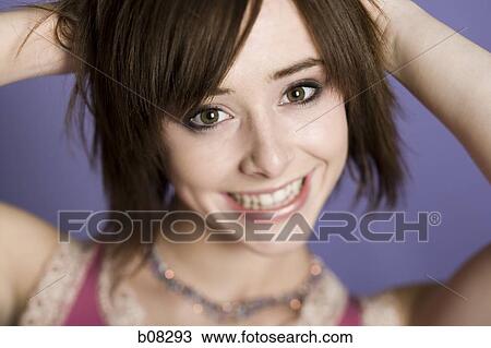 Portrait of a teenage girl smiling View Large Photo Image Stock Image - Portrait of a teenage girl smiling. Fotosearch