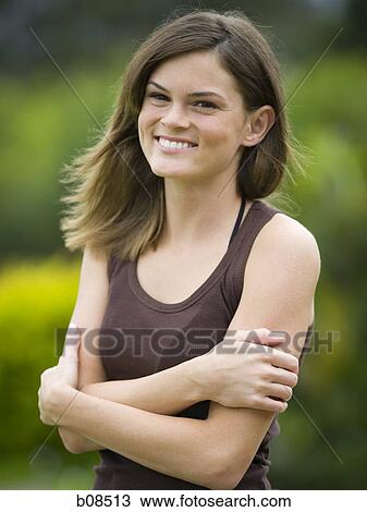 Portrait of a teenage girl smiling View Large Photo Image Stock Image - Portrait of a teenage girl smiling. Fotosearch
