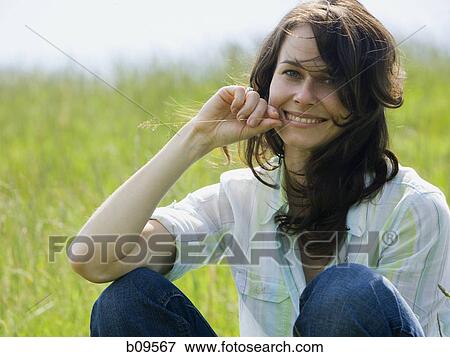 Stock Photo - Portrait of a woman smiling. Fotosearch