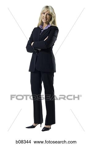 Portrait of a woman smiling with her arms crossed View Large Photo Image Picture - Portrait of a woman smiling with her arms crossed. Fotosearch
