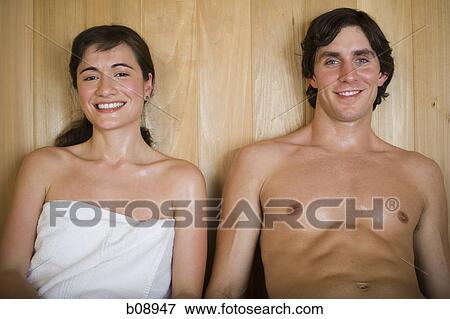 Portrait of a young couple smiling and sitting in a sauna View Large Photo Image Stock Photo - Portrait of a young couple smiling and sitting in a sauna. Fotosearch