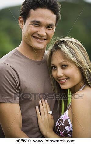 Portrait of a young couple smiling View Large Photo Image Stock Image - Portrait of a young couple smiling. Fotosearch