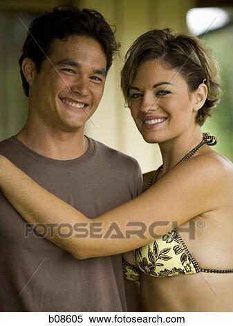 Portrait of a young couple smiling View Large Photo Image Stock Photography - Portrait of a young couple smiling. Fotosearch
