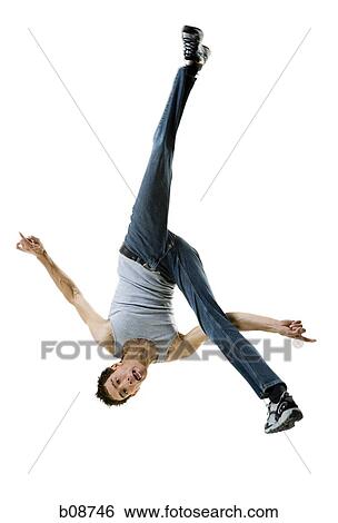 Portrait of a young man doing a back flip View Large Photo Image Stock Photograph - Portrait of a young man doing a back flip. Fotosearch
