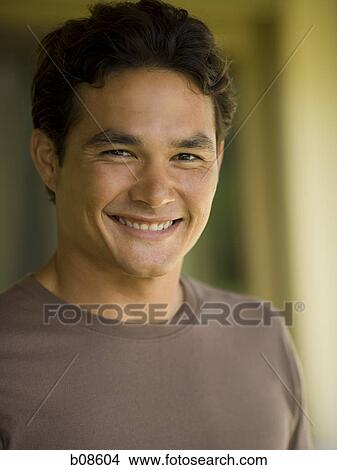 Portrait of a young man smiling View Large Photo Image Picture - Portrait of a young man smiling. Fotosearch