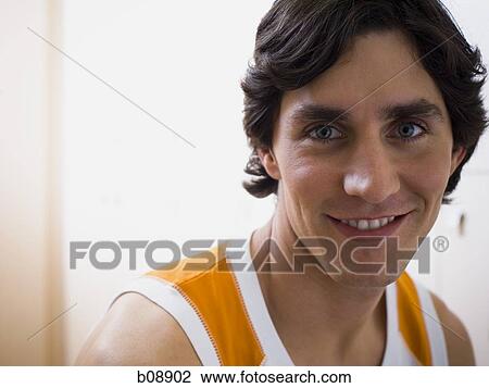 Portrait of a young man smiling View Large Photo Image Stock Image - Portrait of a young man smiling. Fotosearch
