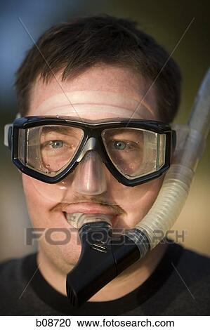 Portrait of a young man wearing a snorkel View Large Photo Image Stock Image - Portrait of a young man wearing a snorkel. Fotosearch