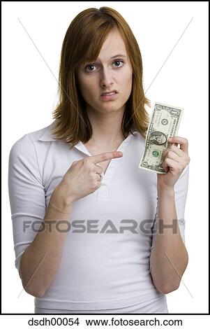 Portrait of a young woman holding an American one dollar bill View Large Photo Image Picture - Portrait of a young woman holding an American one dollar bill. Fotosearch