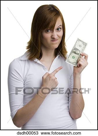Portrait of a young woman holding an American one dollar bill View Large Photo Image Stock Image - Portrait of a young woman holding an American one dollar bill. Fotosearch