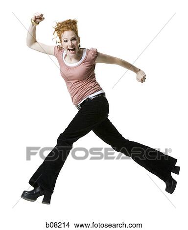Portrait of a young woman jumping in mid-air View Large Photo Image Picture - Portrait of a young woman jumping in mid-air. Fotosearch