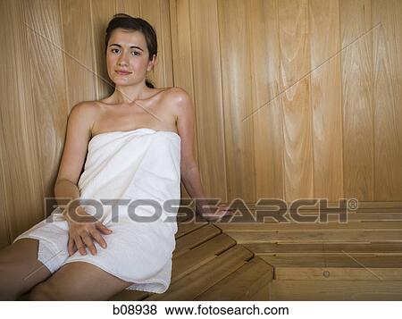 Portrait of a young woman relaxing in a sauna View Large Photo Image Stock Photo - Portrait of a young woman relaxing in a sauna. Fotosearch