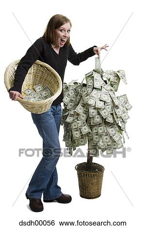 Portrait of a young woman standing near a money tree View Large Photo Image Stock Photograph - Portrait of a young woman standing near a money tree. Fotosearch