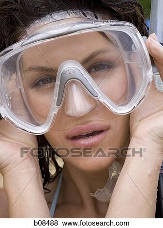 Portrait of an adult woman wearing a scuba mask View Large Photo Image Stock Photo - Portrait of an adult woman wearing a scuba mask. Fotosearch