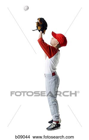 Profile of a baseball player standing in a catching position View Large Photo Image Picture - Profile of a baseball player standing in a catching position. Fotosearch