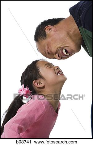 Profile of a girl and her father looking at each other, smiling View Large Photo Image Stock Image - Profile of a girl and her father looking at each other, smiling. Fotosearch