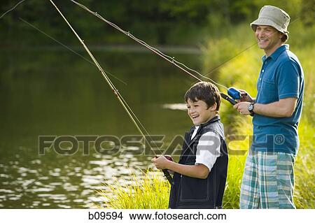 Profile of a man and his son fishing View Large Photo Image Picture - Profile of a man and his son fishing. Fotosearch