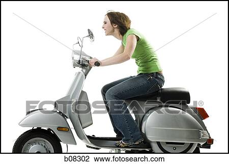 Profile of a teenage girl riding a scooter View Large Photo Image Stock Image - Profile of a teenage girl riding a scooter. Fotosearch