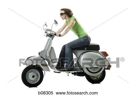 Profile of a teenage girl riding on a scooter View Large Photo Image Stock Photography - Profile of a teenage girl riding on a scooter. Fotosearch