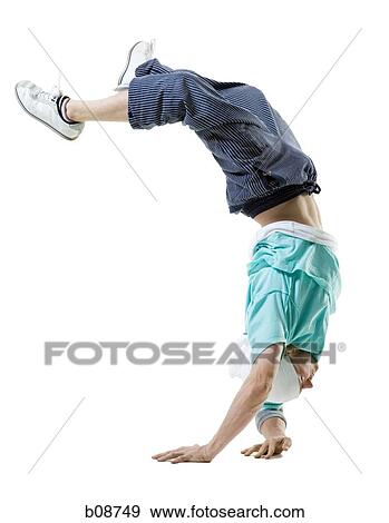 Profile of a young man doing a hand stand View Large Photo Image Stock Photo - Profile of a young man doing a hand stand. Fotosearch
