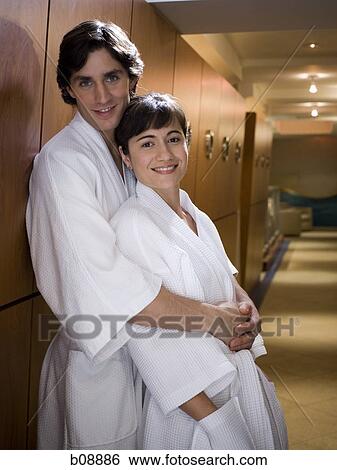 Profile of a young man embracing a young woman from behind View Large Photo Image Stock Photograph - Profile of a young man embracing a young woman from behind. Fotosearch