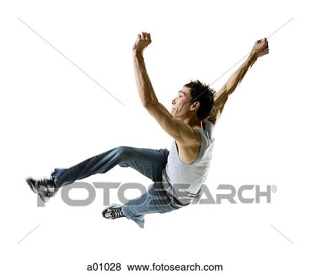 Profile of a young man jumping in mid-air View Large Photo Image Stock Photo - Profile of a young man jumping in mid-air. Fotosearch
