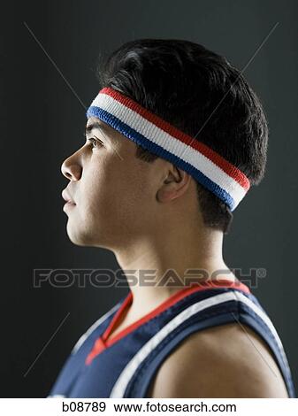 Profile of a young man looking away View Large Photo Image Stock Photo - Profile of a young man looking away. Fotosearch