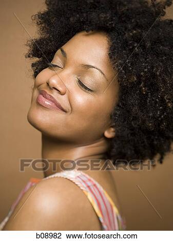 Profile of a young woman day dreaming View Large Photo Image Stock Image - Profile of a young woman day dreaming. Fotosearch