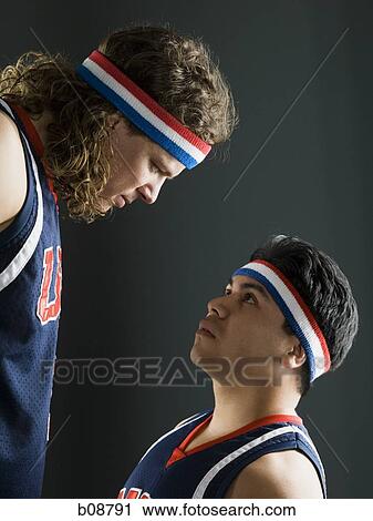 Profile of two young men looking at each other View Large Photo Image Stock Image - Profile of two young men looking at each other. Fotosearch