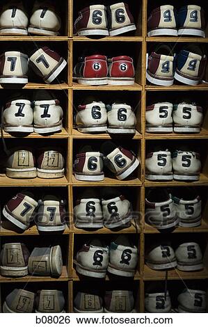 Rack of bowling shoes View Large Photo Image Stock Photograph - Rack of bowling shoes. Fotosearch