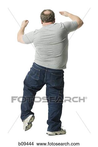 Rear view of a mature man dancing View Large Photo Image Picture - Rear view of a mature man dancing. Fotosearch