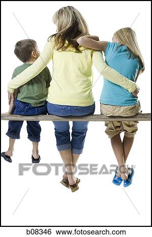 Stock Photograph - Rear view of a mother and her two children sitting on a wooden plank. Fotosearch