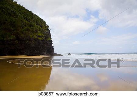 Reflection of a rock formation in water View Large Photo Image Stock Photo - Reflection of a rock formation in water. Fotosearch