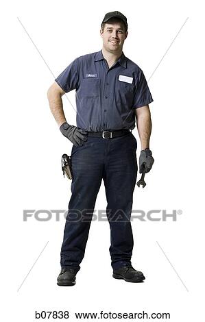 Repairman holding a wrench View Large Photo Image Stock Photo - Repairman holding a wrench. Fotosearch